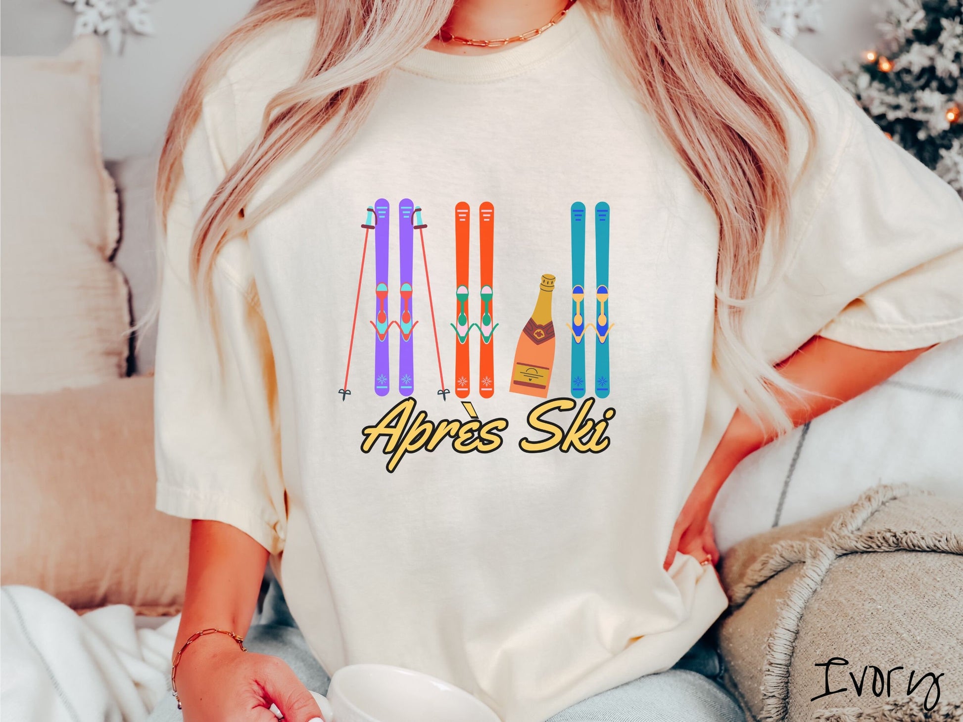 A woman wearing a vintage, ivory colored shirt with sets of purple, orange, and turquoise snow skis standing upright, and a big bottle of champagne next to them. Below the skis is the text Apres Ski which is French for After Skiing.