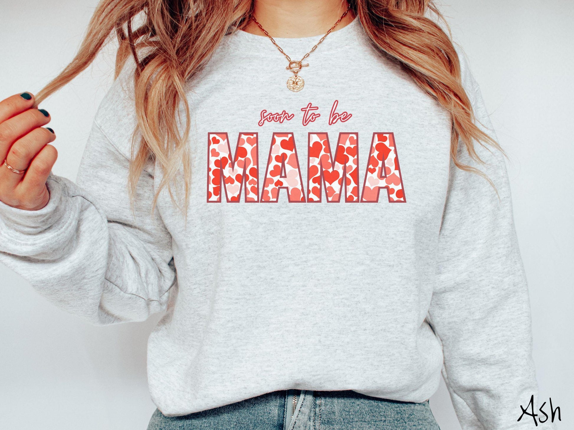 Celebrate your journey to motherhood with this vintage Gildan sweatshirt featuring the phrase “Soon to Be Mama” in bold red font, and the word “Mama” stands out in block letters filled with colorful hearts for a playful and charming touch.