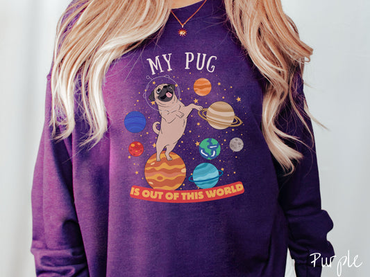 A vintage Gildan sweatshirt featuring the text My Pug is Out of This World. The design showcases an adorable Pug sitting proudly atop Jupiter, surrounded by a vibrant solar system filled with colorful planets and twinkling stars.