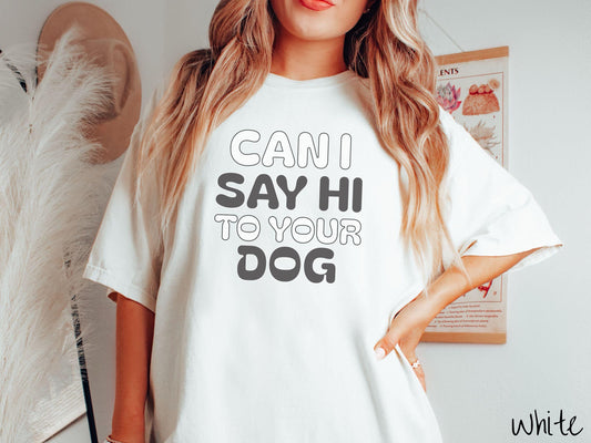 This vintage Comfort Colors t-shirt is perfect for dog lovers who want to make a bold statement. Featuring the text &quot;CAN I SAY HI TO YOUR DOG&quot; in uppercase black and white font, this shirt combines comfort and style with a playful message.