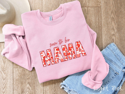 Celebrate your journey to motherhood with this vintage Gildan sweatshirt featuring the phrase “Soon to Be Mama” in bold red font, and the word “Mama” stands out in block letters filled with colorful hearts for a playful and charming touch.