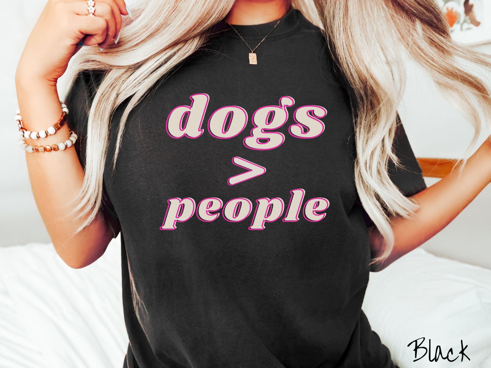 A vintage Comfort Colors t-shirt is perfect for dog lovers who know that dogs are greater than people! Featuring the funny saying Dogs &gt; People, this tee is a must-have for anyone who prefers the company of their furry friends over humans.