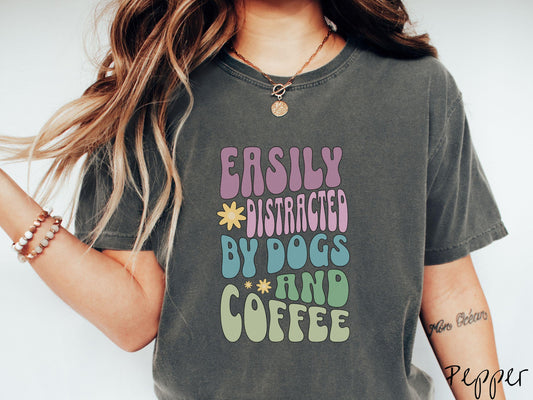 This vintage Comfort Colors t-shirt is a must-have for anyone who loves dogs, coffee, and a touch of humor! Featuring the funny saying Easily Distracted by Dogs and Coffee in vibrant, round font, this design adds a playful vibe to your wardrobe.
