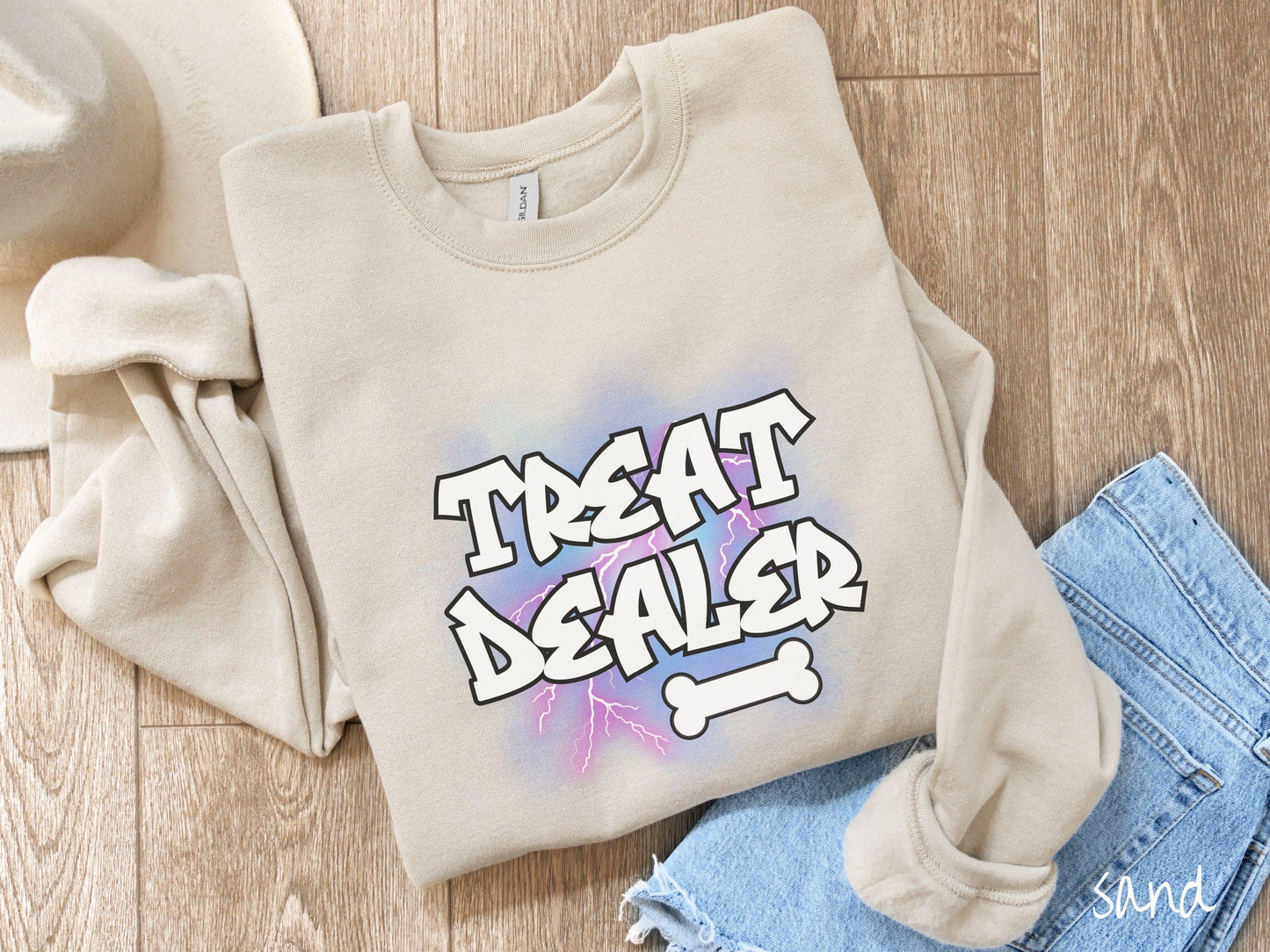 A vintage Gildan sweatshirt for dog lovers who always have treats on hand! Featuring the playful text Treat Dealer in graffiti-style white font, this design makes a fun statement for pet parents, dog trainers, and anyone who spoils their pup.