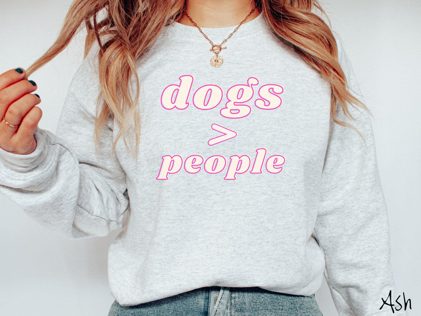 A vintage Gildan sweatshirt is perfect for dog lovers who know that dogs are greater than people! Featuring the funny saying Dogs > People, this tee is a must-have for anyone who prefers the company of their furry friends over humans.