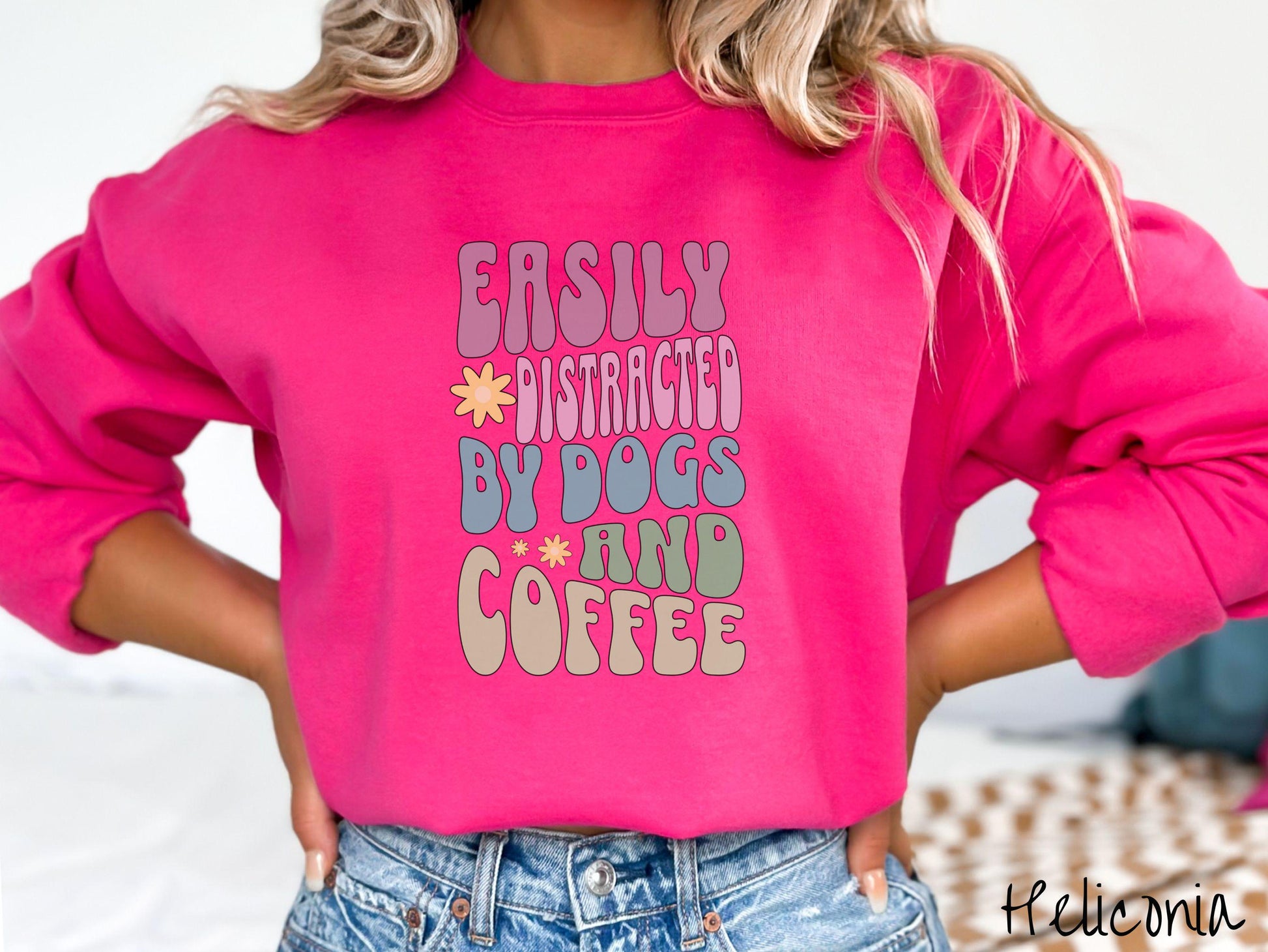 This vintage Gildan sweatshirt is a must-have for anyone who loves dogs, coffee, and a touch of humor! Featuring the funny saying Easily Distracted by Dogs and Coffee in vibrant, round font, this design adds a playful vibe to your wardrobe.