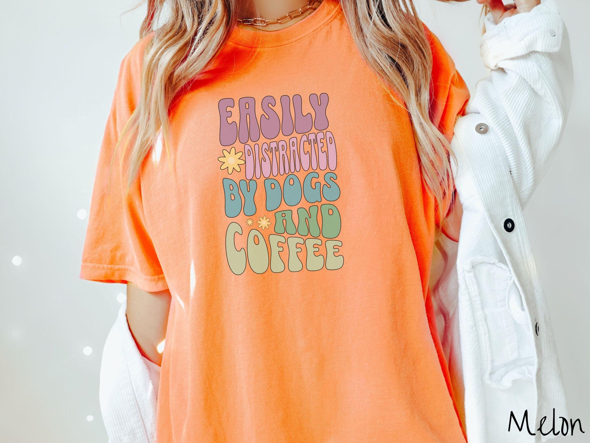 This vintage Comfort Colors t-shirt is a must-have for anyone who loves dogs, coffee, and a touch of humor! Featuring the funny saying Easily Distracted by Dogs and Coffee in vibrant, round font, this design adds a playful vibe to your wardrobe.
