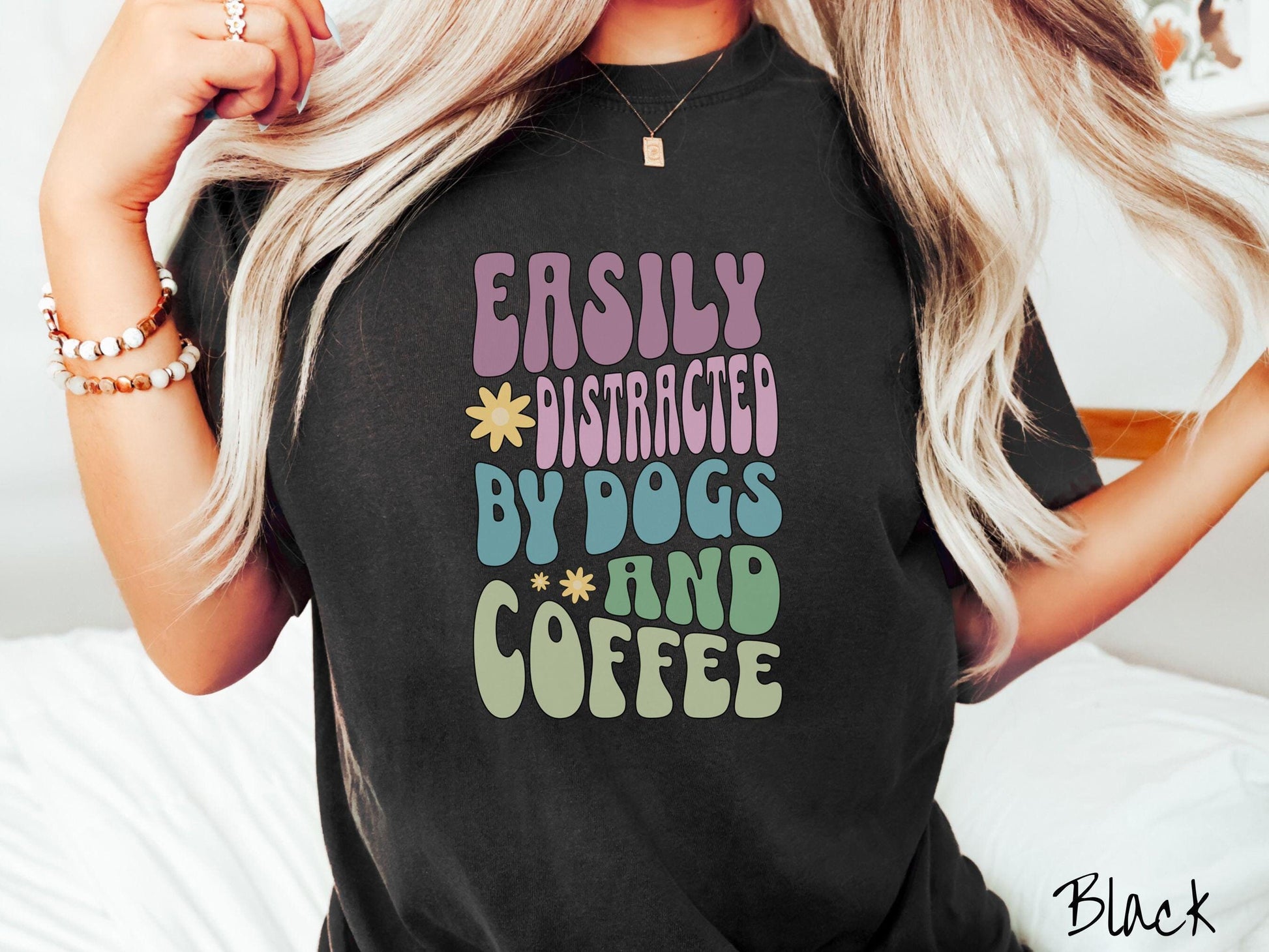 This vintage Comfort Colors t-shirt is a must-have for anyone who loves dogs, coffee, and a touch of humor! Featuring the funny saying Easily Distracted by Dogs and Coffee in vibrant, round font, this design adds a playful vibe to your wardrobe.
