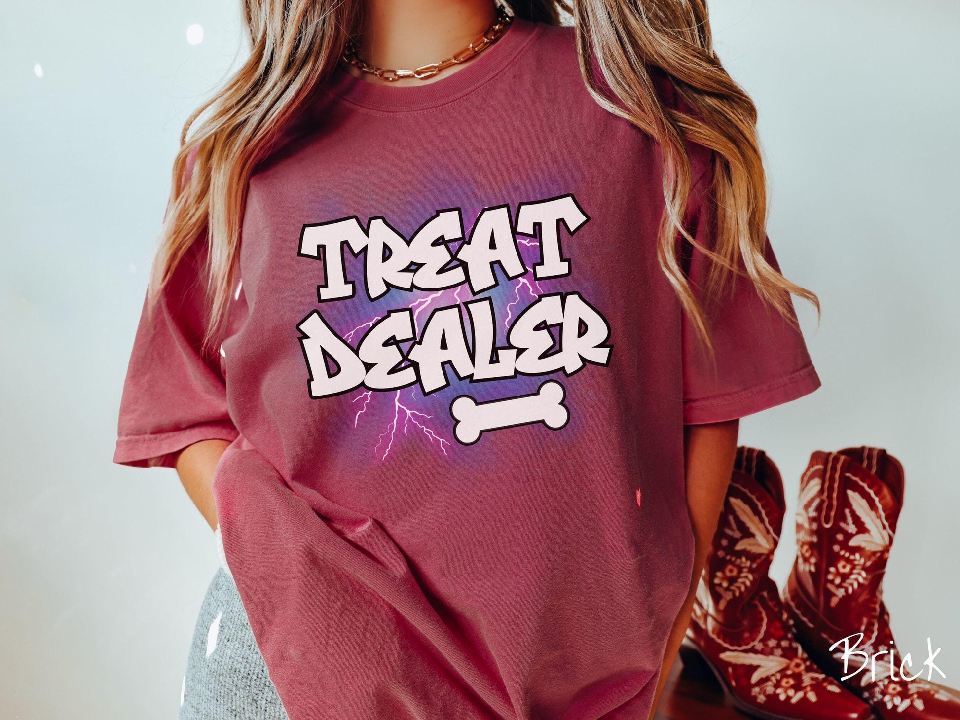 A vintage Comfort Colors t-shirt for dog lovers who always have treats on hand! Featuring the playful text Treat Dealer in graffiti-style white font, this design makes a fun statement for pet parents, dog trainers, and anyone who spoils their pup.